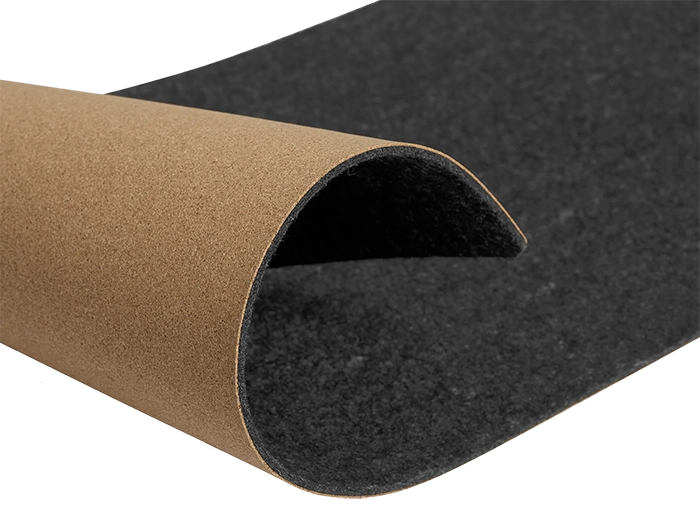 A partly rolled up desk mat. On the top is has a soft felt, and underneath is cork